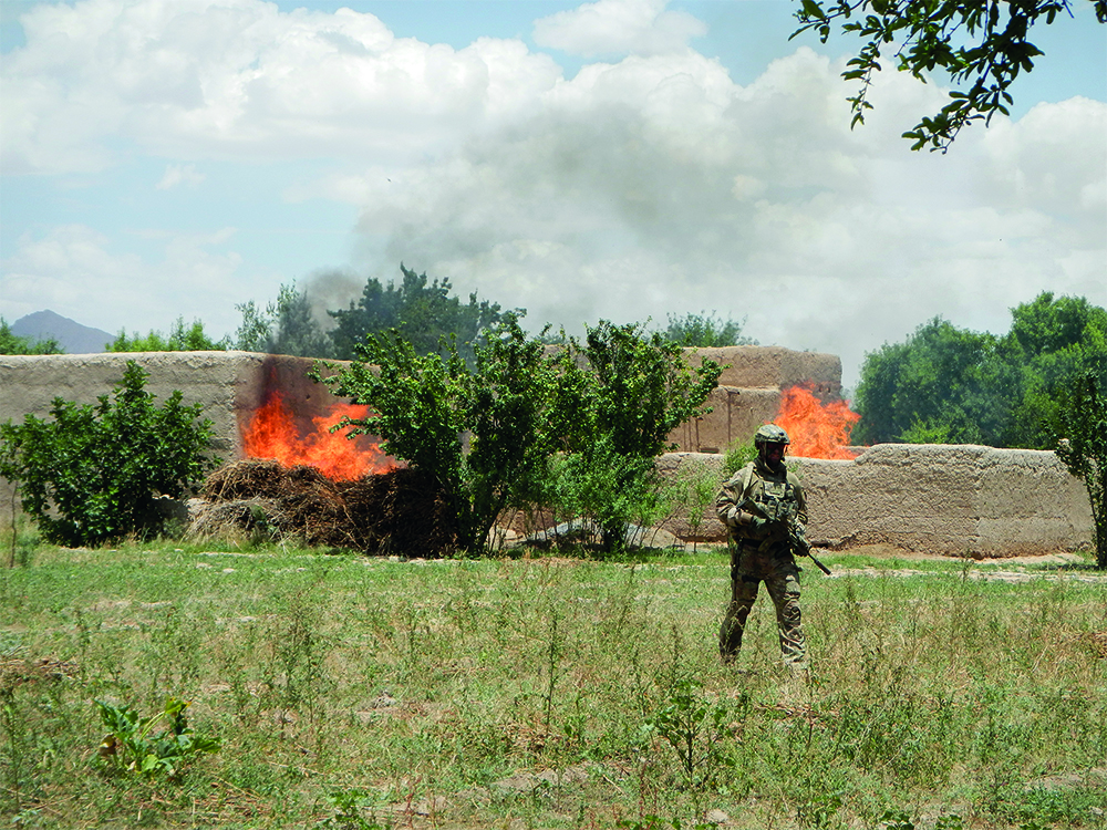 An Afghan compound burning during an SAS operation (photograph via Simon & Schuster)